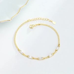 Close-up of gold S925 silver bracelet featuring five rectangular cubic zirconia stones