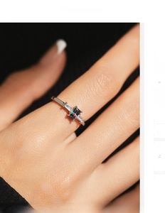 Macro detail of a 925 silver ring featuring a sparkling rectangular multicolor crystal stone