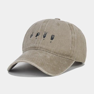 Detail view of khaki washed cotton baseball cap with LOVE hand sign embroidery