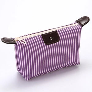 Striped purple and white waterproof canvas makeup bag with brown leather trim and snap