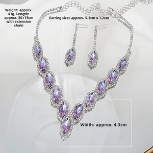 Macro detail of V-shaped bridal necklace set with purple marquise crystals and silver finish