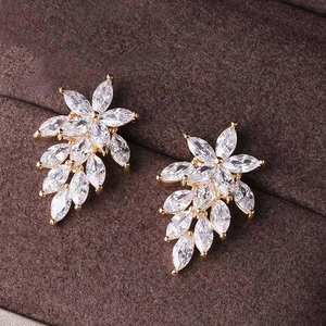 Sparkling marquise-cut zircon flower stud earrings in gold plating on a velvet display