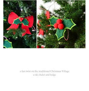 Detail of red felt bow and holly leaf ornaments with berries for Christmas tree decoration