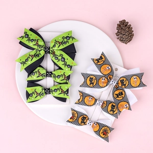 Three-piece Halloween bow hair clips set with pumpkin and spider motifs for girls