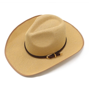 Detail of woven straw cowboy hat featuring a brown leather belt and gold buckle