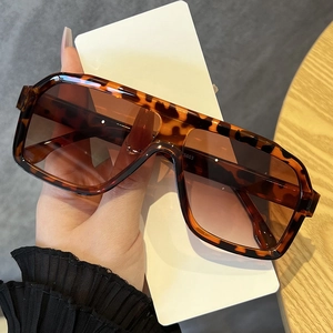 Detail view of large leopard print polarized sunglasses with a stylish coffee finish
