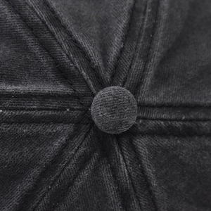 Macro shot of dark gray washed cotton baseball cap crown with reinforced stitching details