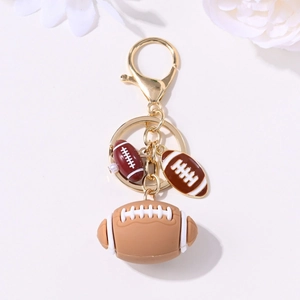 Golden football keychain with brown rubber and enamel pendants for sports fans' backpacks