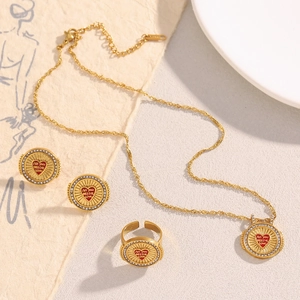 Detailed set of 18K gold plated jewelry with red heart pendants and zircon inlay
