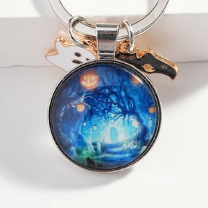 Halloween keychain featuring glowing pumpkin glass pendant with ghost and bat charms
