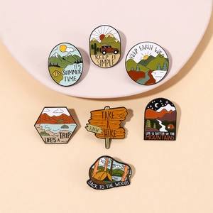 Detailed close-up of 7-piece outdoor camping enamel pins set on a beige background
