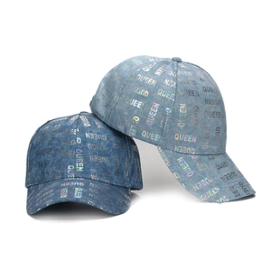 Denim baseball caps with holographic Queen lettering in dark and light blue shades