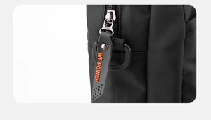 Detail of durable black nylon fabric and SBS metal zipper with orange rubber puller tab