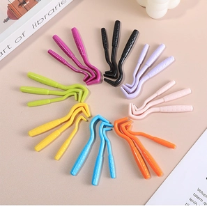 Three-piece tick remover set with non-slip handle in multiple colors shown on soft background