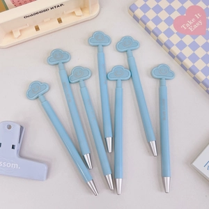 Detail of light blue cloud-topped retractable gel pens in a 7-piece stationery set