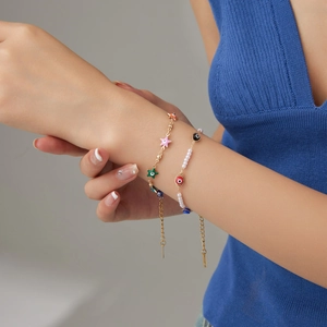 Stainless steel layered bracelet set with colorful stars, pearls and evil eye charms