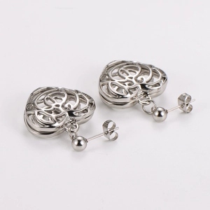Fashionable stainless steel hollow heart stud earrings with knot pattern and silver ball charm
