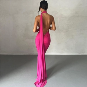 Detailed back view of a magenta backless halter maxi dress with silky silhouette