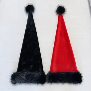 Red and black velvet Christmas hats with long pointed tails and plush black pom-poms