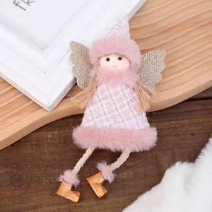 Pink Christmas angel doll hanging ornament with gold sequin wings on rustic wood