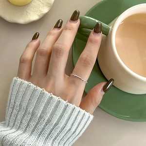 Elegant S925 sterling silver hollow bow ring for women shown in a lifestyle setting