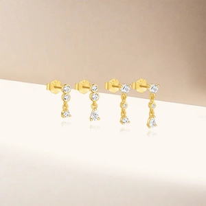 Macro shot of S925 sterling silver gold stud earrings with cubic zirconia and S925 hallmark