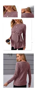 Detail of pink long sleeve maternity sweater with ribbed texture and adjustable waist belt