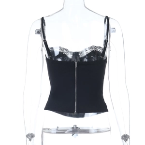 Detail of a back metal zipper on a black lace camisole top with adjustable straps