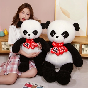Detail of plush panda toys in two sizes featuring a red 'Love' bow and soft fur texture