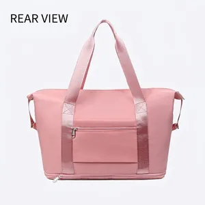 Rear view of pink waterproof travel bag with reinforced straps and external zip pocket