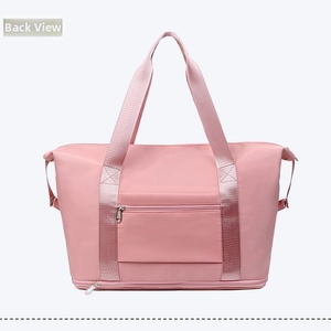 Rear view of pink waterproof travel bag with reinforced straps and external zip pocket