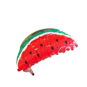 Acrylic watermelon claw clip with vibrant red and green colors for unique summer hair styling