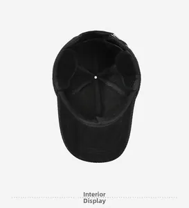 Detailed view of the internal lining and reinforced seams of a black baseball cap