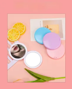 Close-up of colorful round folding mirrors in macaron colors for DIY craft decoration