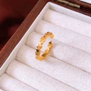 Vintage style 24k gold plated adjustable ring with wavy textured design on wooden box