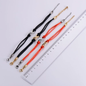 Infinity symbol braided rope bracelet measurement showing length on a metric ruler