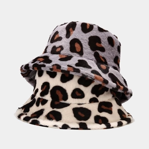 Close-up of leopard print faux fur bucket hats in grey and beige with soft texture