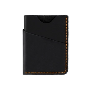 Detail shot of black leather card holder with contrast orange stitching and pebble grain texture