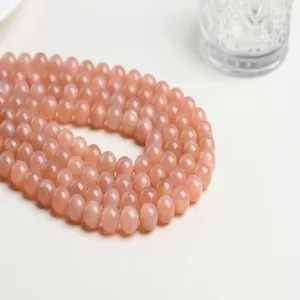 Polished sunstone round loose beads in warm pink-orange for DIY jewelry making