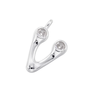 Macro detail of V-shaped silver pendant with two sparkling gemstones on a white background