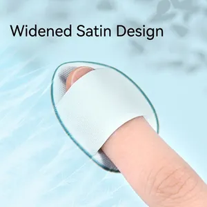 Mini light blue finger puff with wide satin strap for precise makeup concealer application