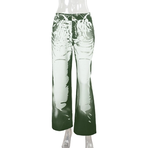 Detail view of high-waisted dark green and white abstract print streetwear trousers