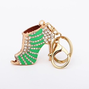 Detail of green enamel high heel keychain with sparkling rhinestones and lobster clasp