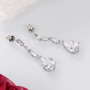 Detail shot of silver drop earrings with marquise and pear-shaped cubic zirconia crystals
