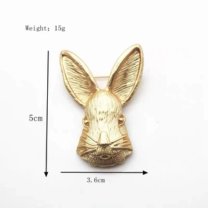 Golden rabbit head brooch with detailed hair texture, dimensions 5cm x 3.6cm