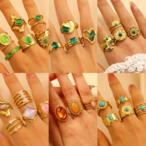 Bohemian gold plated stainless steel rings set with colorful stones on female hands