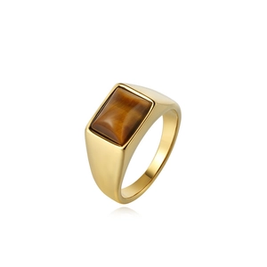 Macro view of golden stainless steel signet ring with inlaid rectangular tiger eye stone