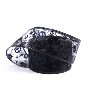Black mesh Halloween ribbon with white skull and spider web prints for DIY decor