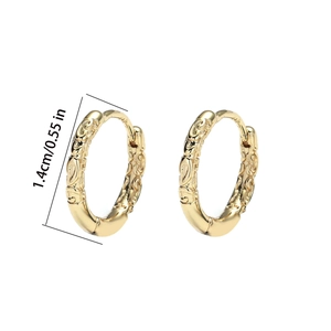 Macro detail of 1.4cm vintage engraved gold hoop earrings with 925 silver posts