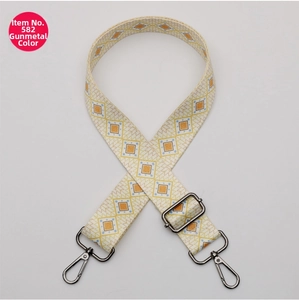 Detail of adjustable polyester strap with beige geometric weave and gunmetal hooks